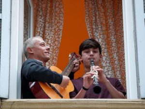 Italians in self-quarantine this week hold impromptu concerts from their balconies and jam with their neighbours. 