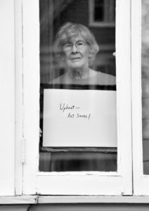 Artist Shirley Fuerst poses for 'Words At The Window: Self Isolation And The Coronavirus', a portrait series by Shutterstock Staff Photographer, Stephen Lovekin, shot around the Ditmas Park neighborhood of Brooklyn, New York.