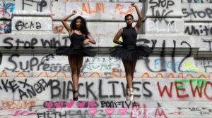 Ballerinas Kennedy George, 14, and Ava Holloway, 14, dance before the monument of Confederate general Robert E. Lee in Richmond, Virginia, June 5, 2020. Julia Rendleman photo. 