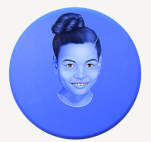 Self Portrait, 201 Water Based oil on canvas 24 inches diameter by Lava Thomas as part of her ongoing project Childhood, which depicts the realistic colors of the subject's teeth, gums and eyes, while the skin and hair incorporate shades of ultramarine blue - historically the most expensive pigment used by Renaissance painters. 