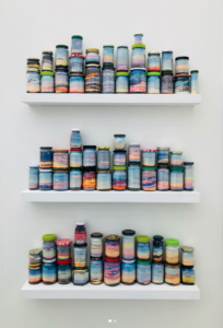 Canning the Sunset, 2021 Colored sand, recycled jars 13 × 36 × 5 inches by Carly Glovinsky (b. 1981) Part of Morgan Lehman Gallery's presentation at Untitiled Art, Miami Beach, 2021