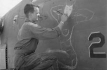 Sgt. J.S. Wilson painting a bomber based at Eniwetok in June 1944.